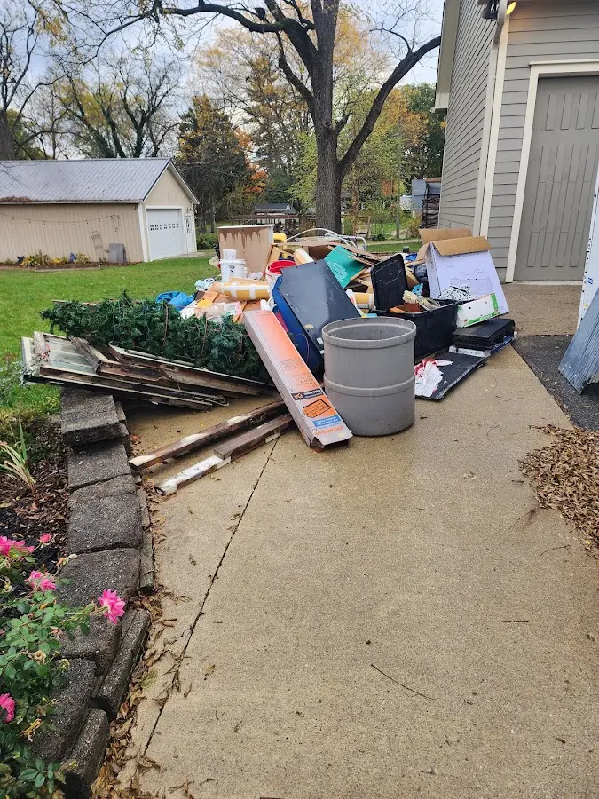 Dumpster being loaded with debris for Estate Cleanout Dumpster Rental in Lebanon